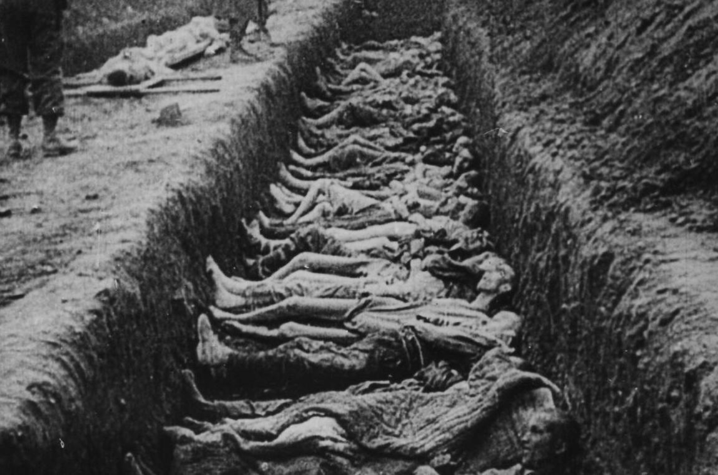 Dead, naked bodies in a trench-like mass grave.