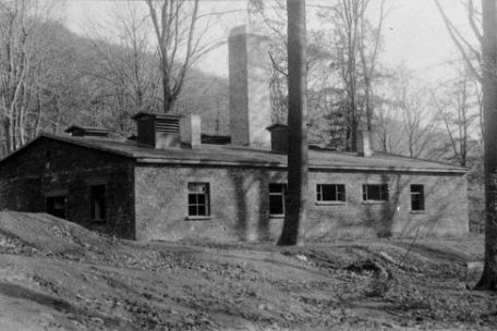 View of the crematorium of Mittelbau-Dora concentration camp with its characteristic central chimney.