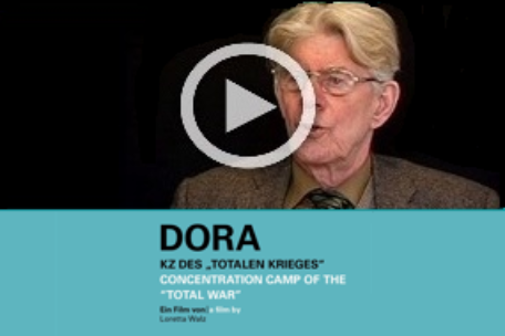 Screenshot zum Video "Dora - KZ des totalen Krieges". Das Bild zeigt eine Person in einer Interviewsituation.