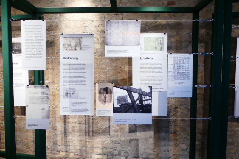 Exhibition wall in the special exhibition "Flight". It is a composite of historical images and text materials stretched in a metal frame.